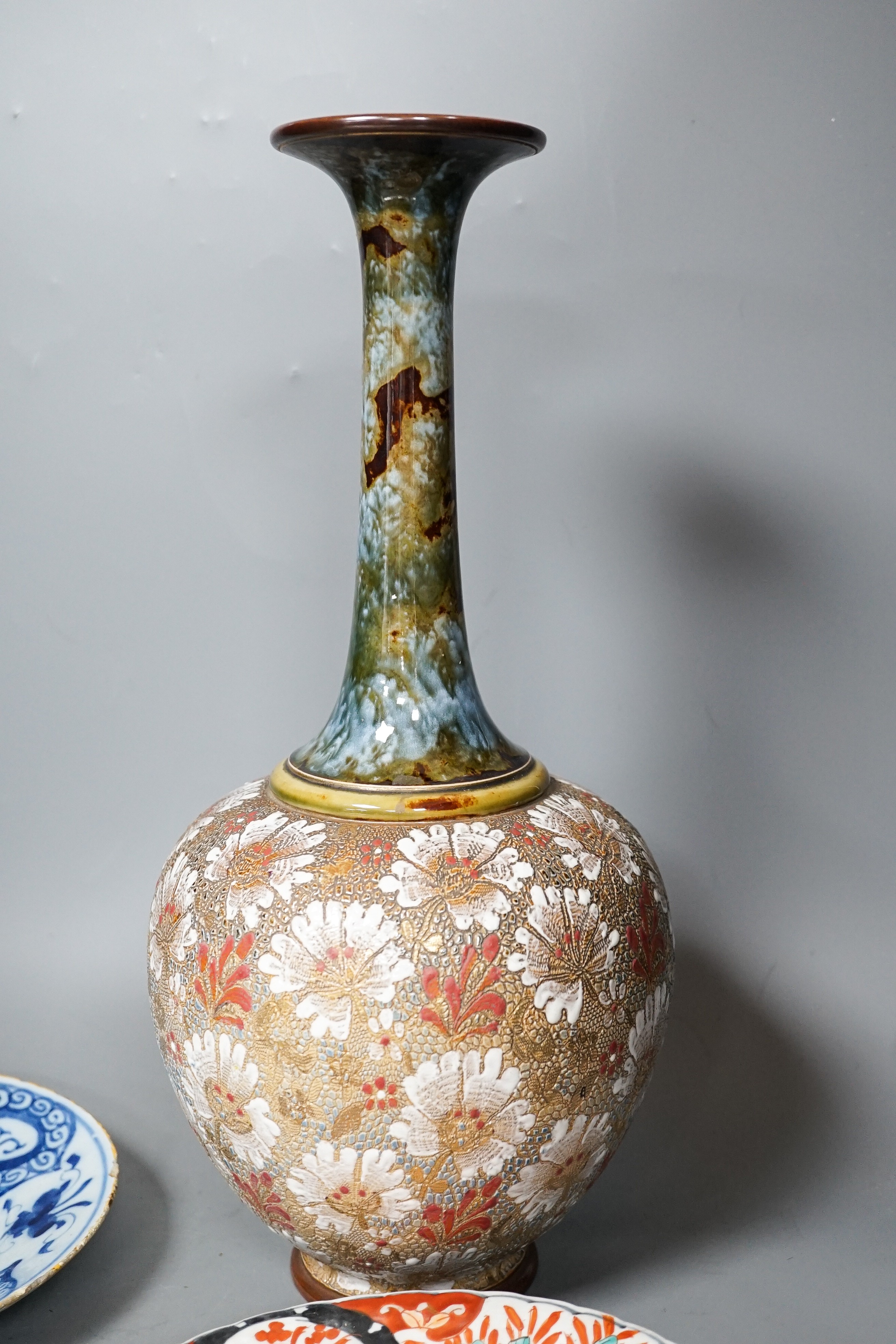 A Doulton slaters patent vase, height 40cm, two Imari dishes and an 18th century Delft blue and white plate